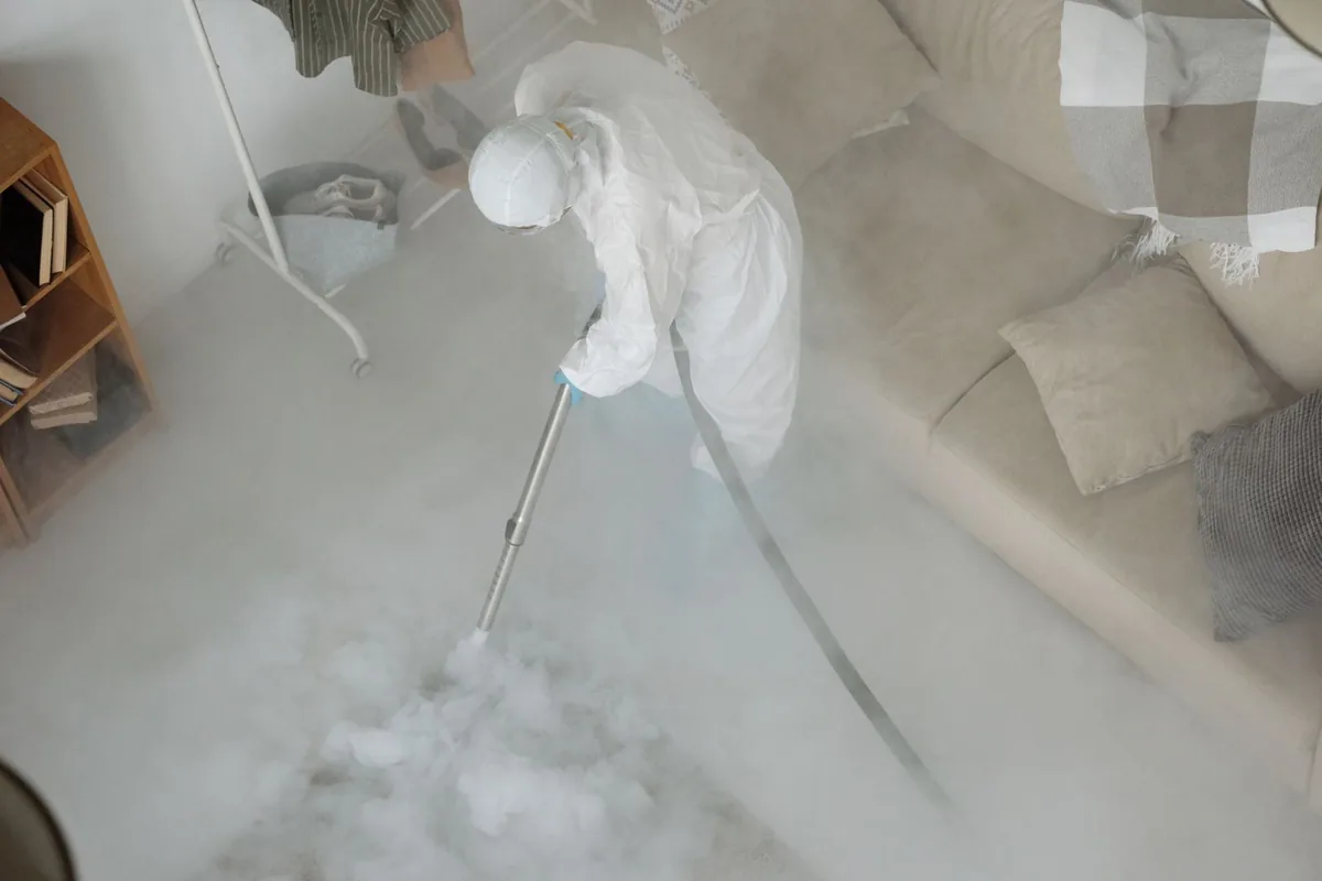 Biohazard cleanup technician in protective equipment, Morada, CA